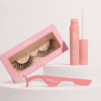 3D faux mink lash bundle featuring luxury lashes, adhesive, and applicator in stylish pink packaging.