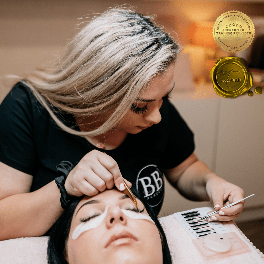 Beginner Eyelash Extension Training at Bombshell Beauty Academy with a trainer applying lashes to a model.