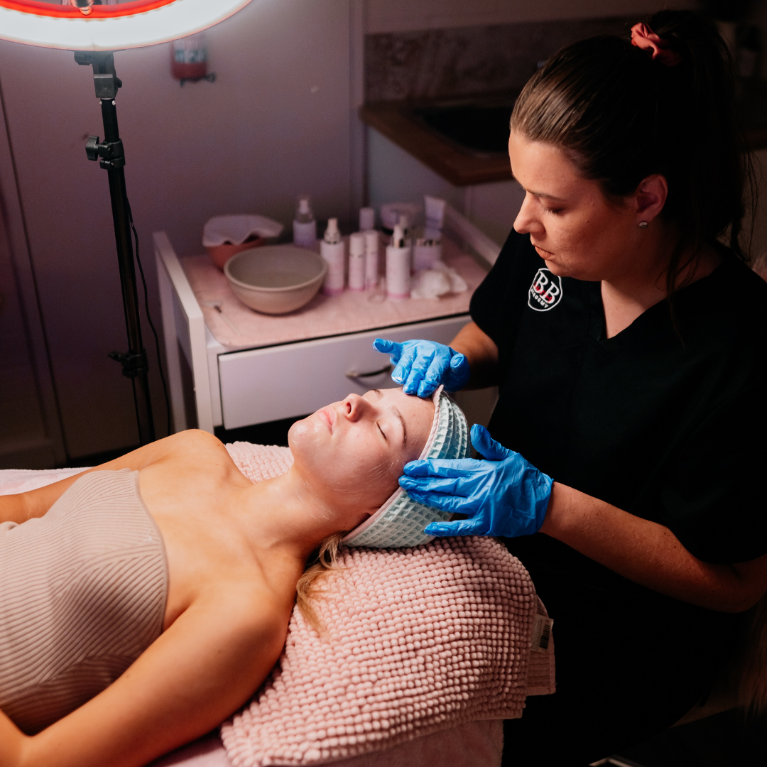 Professional Beauty Services training session with a beautician performing a facial treatment.